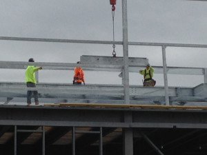 Lowering the Last Beam into Place